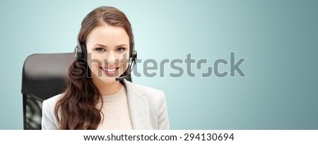 people, online service, communication and technology concept - smiling female helpline operator with headset over blue background