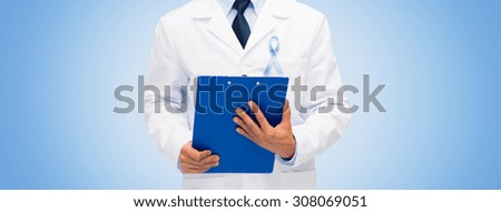 healthcare, profession, people and medicine concept - close up of male doctor in white coat with sky blue prostate cancer awareness ribbon and clipboard