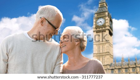 family, age, tourism, travel and people concept - happy senior couple over big ben clock tower in london