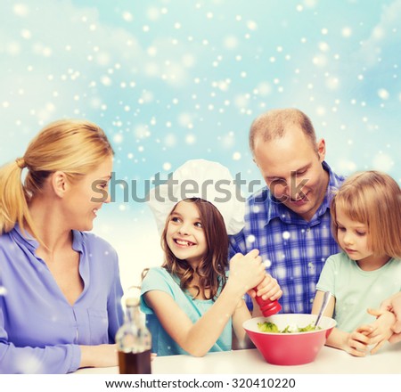 food, family, children, happiness and people concept - happy family with two kids making salad for dinner over blue sky and snowflakes background