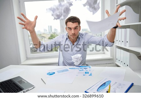 business, people, stress, emotions and fail concept - angry businessman throwing papers in office