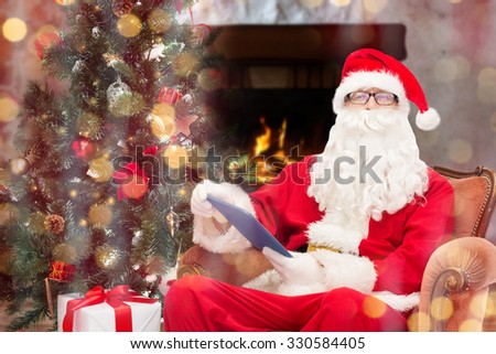 Technology, Holidays And People Concept - Man In Costume Of Santa Claus