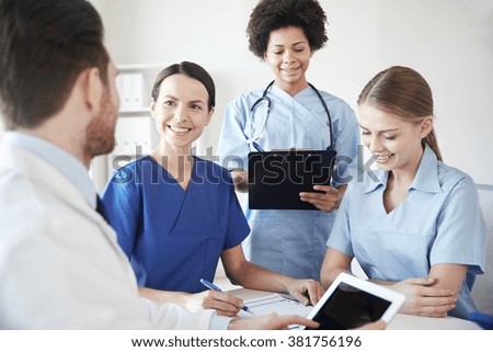 Nurses talking to a doctor in a hospital