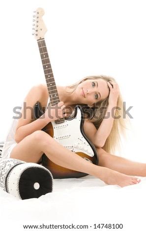 lovely blonde with electric guitar over white