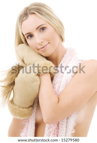 picture of lovely woman in comforter and mittens over white