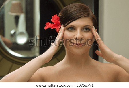 picture of lovely woman looking into mirror