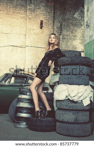 picture of fashionable woman in retro garage