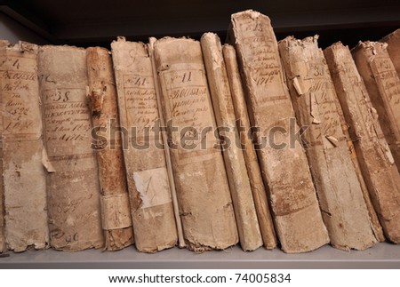 Shelf of old books in a historical archive
