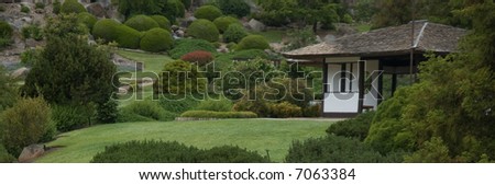 japanese gardens with a building and water feature