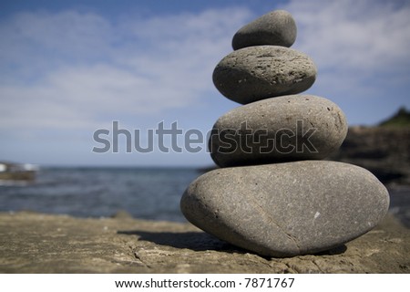 pile of stones against an ocean backdrop