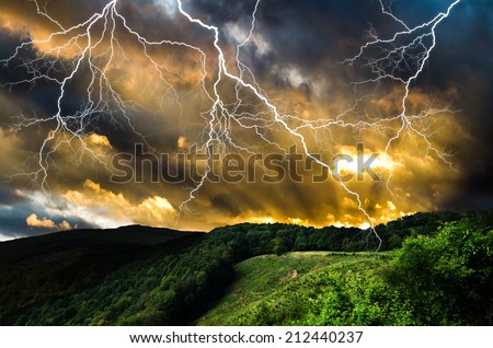 Thunderstorm with lightning in green meadow