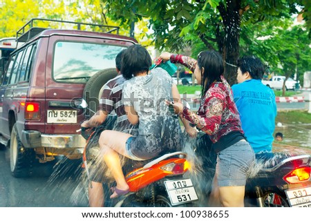 CHIANG MAI, THAILAND - APRIL 15:  People celebrate Thai New Year festival Songkran from 13 to 15 April on the streets by throwing water at each other, on April 15, 2012 in Chiang Mai, Thailand.