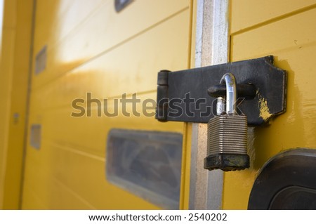 A padlock on warehouse door