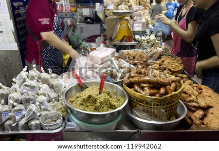 CHIANG MAI, THAILAND - NOV 24: Unidentified shoppers at popular northern food shop in Waroros market on Nov 24, 2012 in Chiang Mai, Thailand. The famous market has been in operation since 1910.