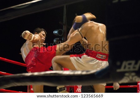 CHIANGMAI, THAILAND- JANUARY 2 : Unidentified Muay Thai fighters compete in a Ancient Thai boxing match at Mueng-kaen Fight on January 2, 2013 in Mae Tang district Chiangmai, Thailand.
