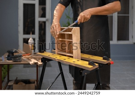 Similar – Image, Stock Photo Senior male woodworker working in garage