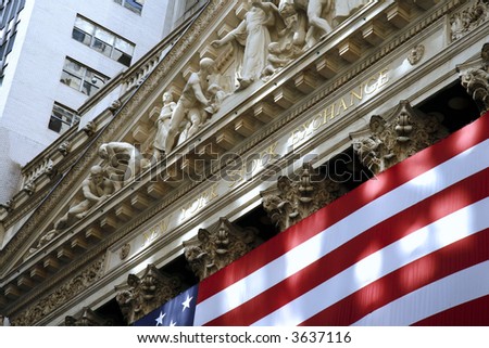 Close up of the New York Stock Exchange building draped with an American flag. (Editorial Use Only)