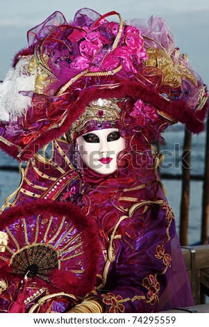 VENICE - MARCH 5: An unidentified person in costume in St. Mark\'s Square during the Carnival of Venice on March 5, 2011 in Venice, Italy.  The 2011 carnival was held from February 26-March 8, 2011.