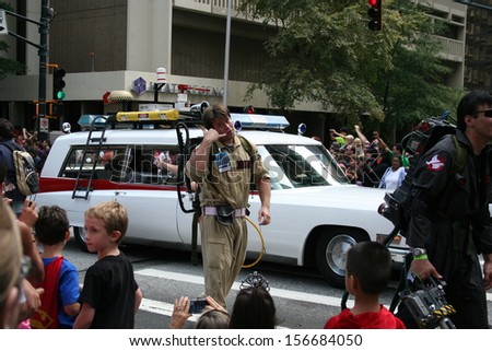 ATLANTA - AUGUST 31: A replica Ghostbusters\' car and someone dressed as a Ghostbuster signaling \