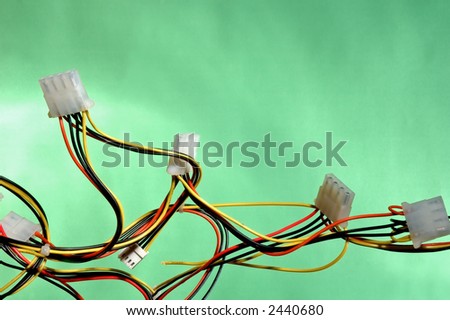 colorful cables of computer power supply on green background