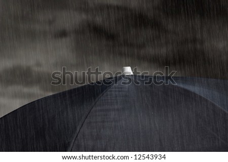 black umbrella with cloudy sky and rain
