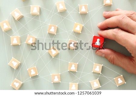 image of wooden blocks with people icon over mint table,building a strong team, human resources and management concept - Image 商業照片 © 