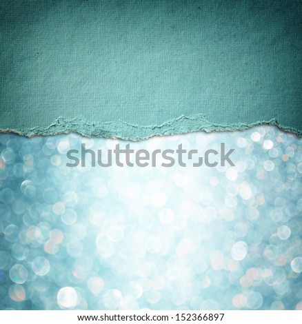 blue glitter background and blue vintage torn paper . room for copy space.