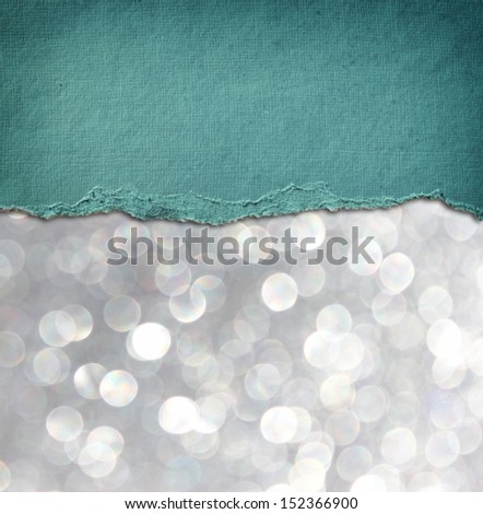 silver glitter background and blue vintage torn paper . room for copy space