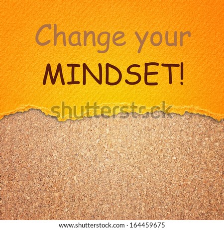 Change your mindset - motivational phrase written on paper over cork board. room for text.