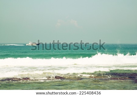 open view image of sea waves and boat in the horizon