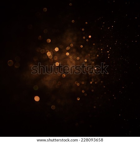 glitter vintage lights background. dark gold and black. defocused