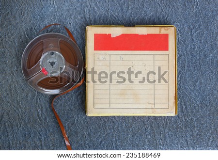 top view of  old sound recording tape, reel to reel type and box with room for text.