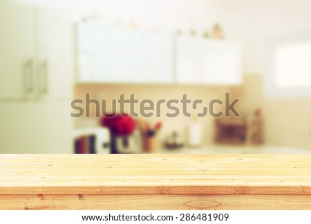 empty table board and defocused white retro kitchen background