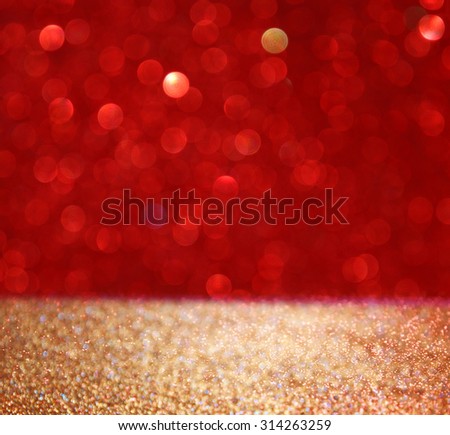 abstract background of red and gold glitter bokeh lights, defocused.