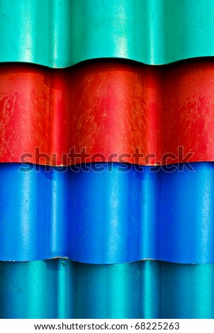 multi color roof tiles in storage for construction work , background texture