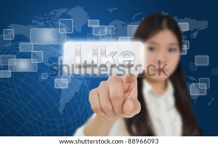 Business woman pressing like button on technology screen