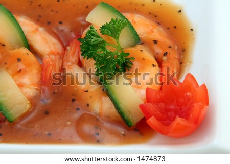 Chinese food, gourmet tiger king prawns served with a vegetables and tomato garnish
