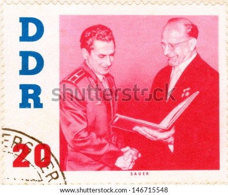 GERMANY - CIRCA 1963: An old used German Democratic Republic postage stamp issued in honor of the visit to GDR second human to orbit the Earth, Soviet cosmonaut Gherman Titov; series, circa 1963