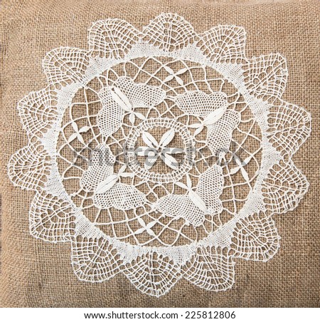 Fragment of handmade retro tapestry textile pattern with floral ornament useful as background