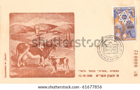 ISRAEL - CIRCA 1950: An Israeli vintage used envelope in honor of kibbutz Kfar Giladi showing kibbutz, fields, buildings and cows with inscription \