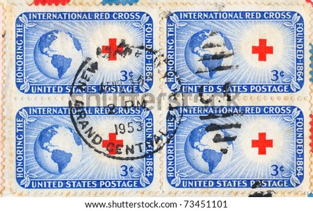 UNITED STATES - CIRCA 1953: An old used four USA postage stamps issued in honor of the founding of the International Red Cross with inscription 