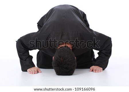 Young Muslim Man Wearing Traditional Clothing Praying And Practicing ...