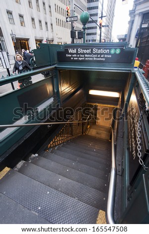 NEW YORK - OCTOBER 28: Subway entrance at Wall Street in NYC on October 28, 2013. Owned by the NYC Transit Authority, the subway system has 469 stations in operation in New York City.