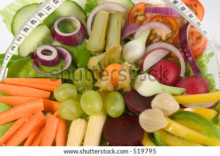 Salad mixture of fruits & vegetables with metric tape measure