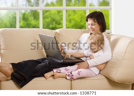 CLIPPING PATH! Mother with daughter on the sofa