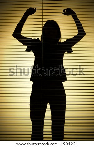 isolated on gold silhouette of woman with hands up (focus on the blind)