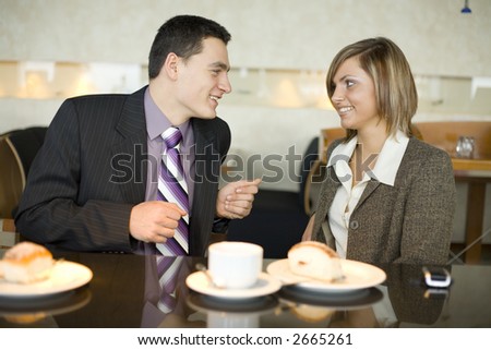 Man and Woman at Cofe Table. Short Depth of Focus (On Their Faces).