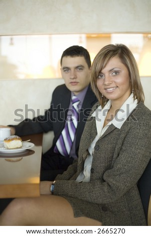 Man and Woman at the Cofe Table. Short Depth of Focus (On Woman\'s Face).