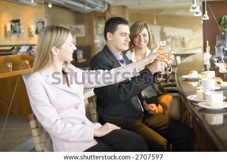 Group of People With Glasses of Champagne. Short Depth of Focus (On Man\'s Face).