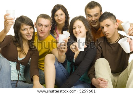 Group of 6 teenagers sitting together. They\'re holding plastic cups and look like have party. White background.